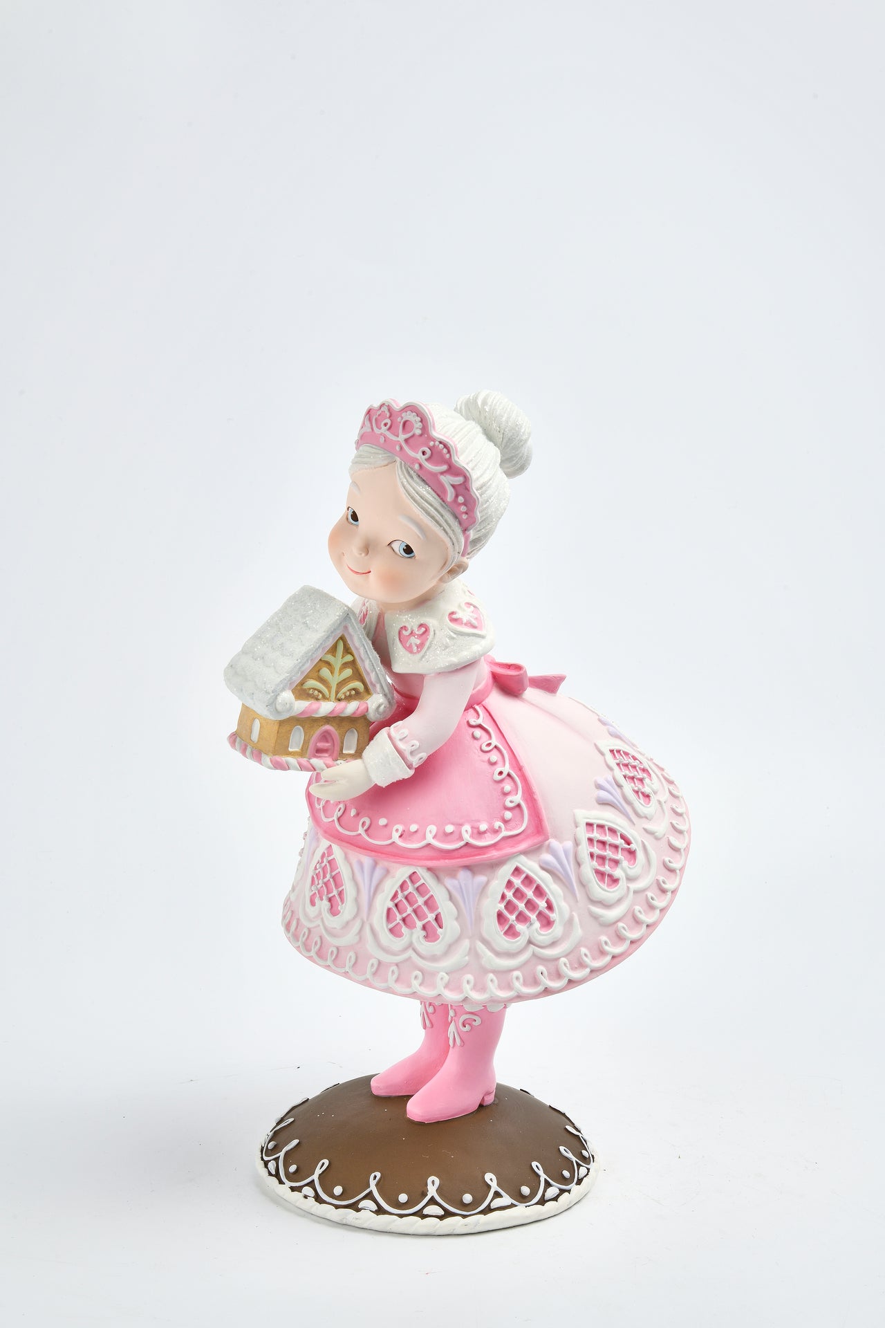 Gingerbread Mrs. Santa Claus With Gingerbread House In Hand