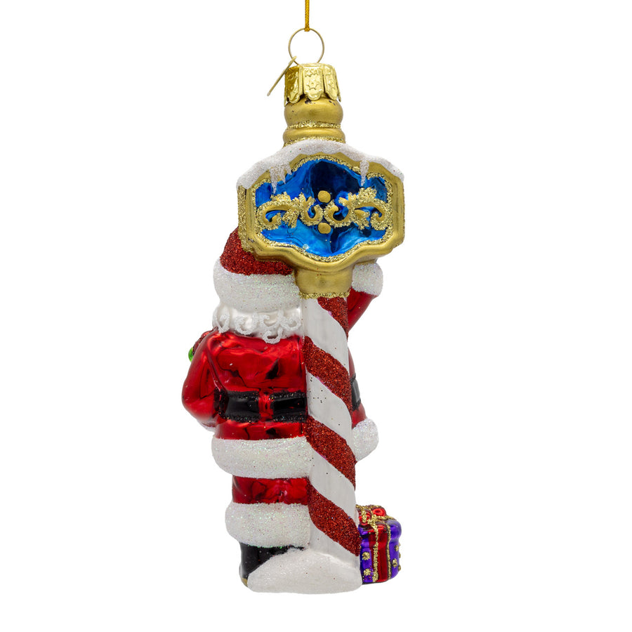 Noble Gems™ Glass Santa At North Pole Ornament