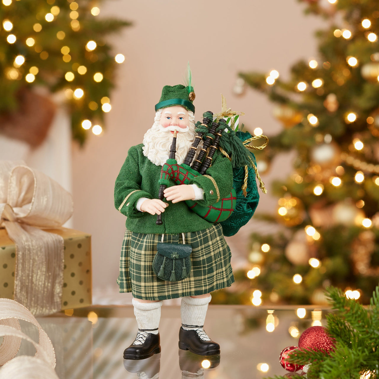 10.5" Fabriché™ Musical Irish Bagpiper Santa